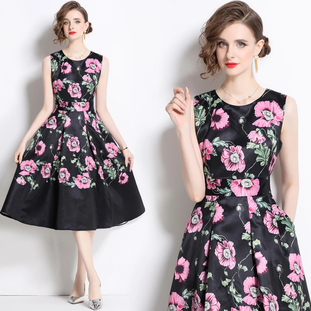 A model wearing a sleeveless, floral print, A-line midi dress with an empire waistline.