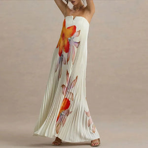 Woman wearing a floral strapless dress on a beige background