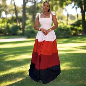 Woman wearing a white, red, and black dress