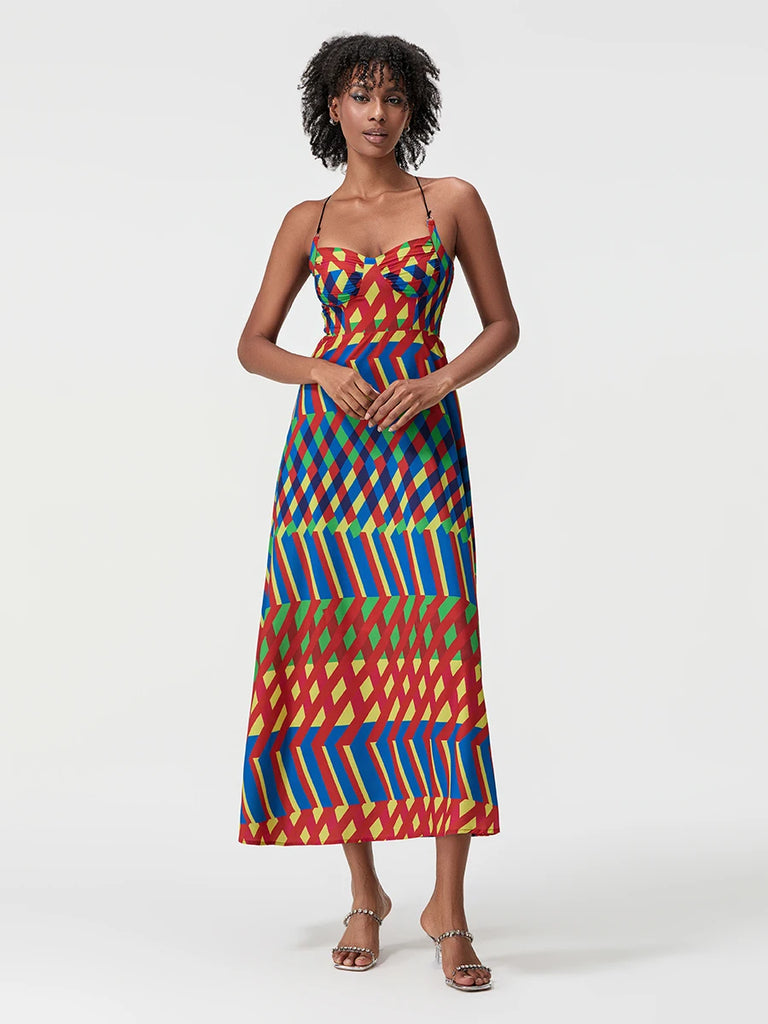 Woman wearing a colorful patterned dress on a white background
