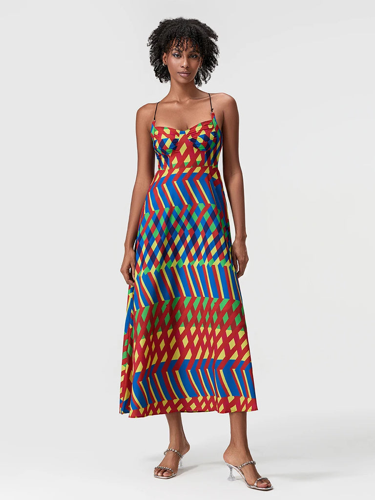 Woman wearing a colorful patterned dress on a white background