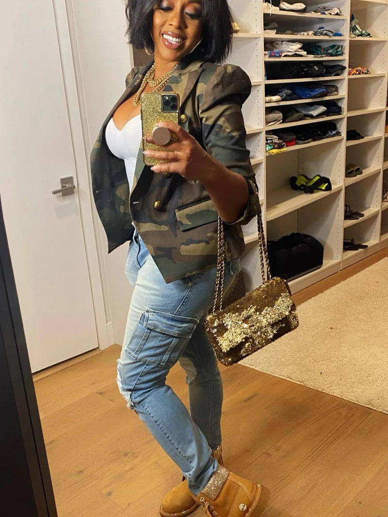 Woman taking a selfie in a room with shelves filled with shoes