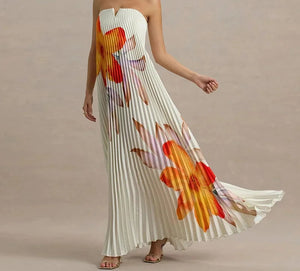 Woman wearing a floral strapless dress with ZJASXMS branding.