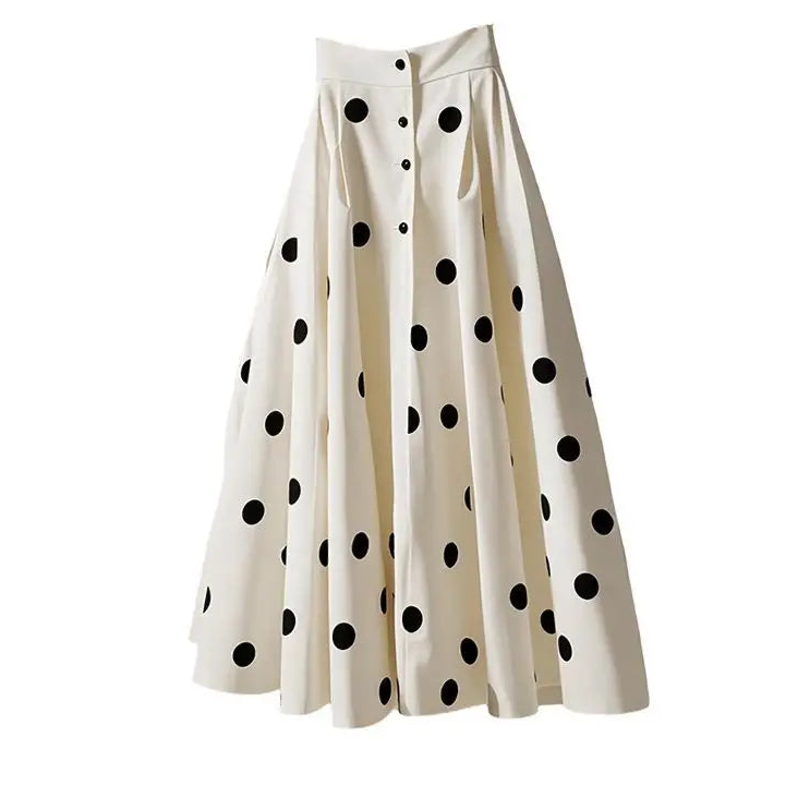 White skirt with black polka dots on a white background