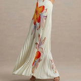 Long white dress with colorful floral pattern on a neutral background