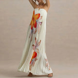 Woman wearing a floral strapless dress on a beige background
