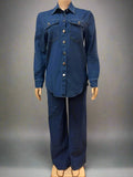 Mannequin wearing a blue denim outfit against a white curtain background