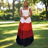 Woman wearing a white, red, and black dress 