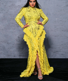 Woman wearing a yellow lace dress against a gray background
