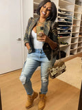 Woman taking a selfie in a room with shelves filled with shoes