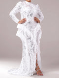 Woman wearing a white lace dress with a gray background