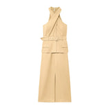 Beige sleeveless dress with a belt on a white background
