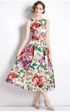 A model wearing a sleeveless, floral print, A-line midi dress with an empire waistline.