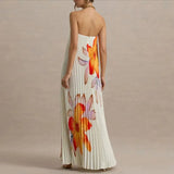 Woman wearing a floral strapless dress on a beige background