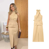 Woman wearing a beige dress with a belt, standing next to an image of the dress.